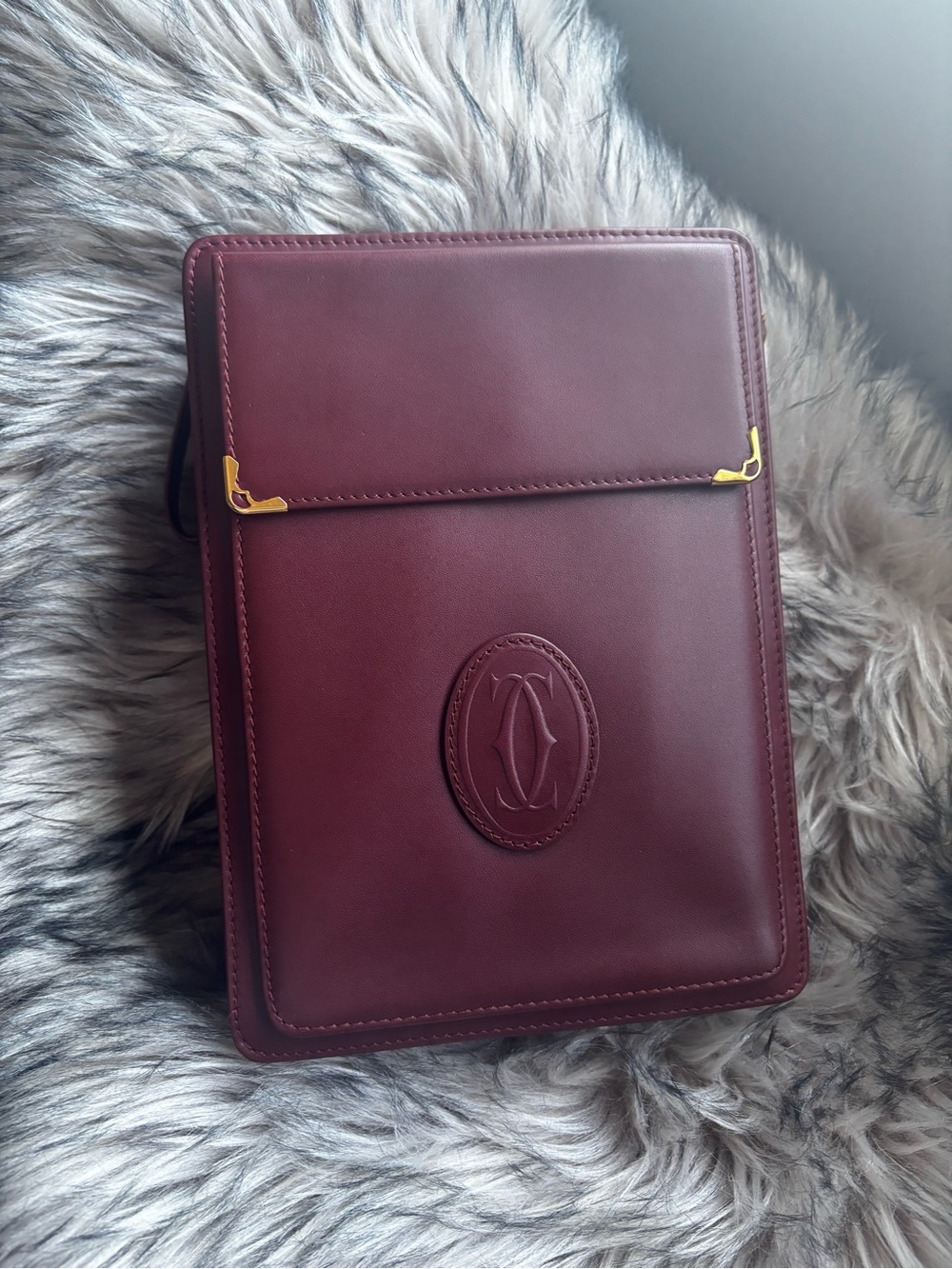 Cartier Burgundy Leather Clutch with Gold Accents
